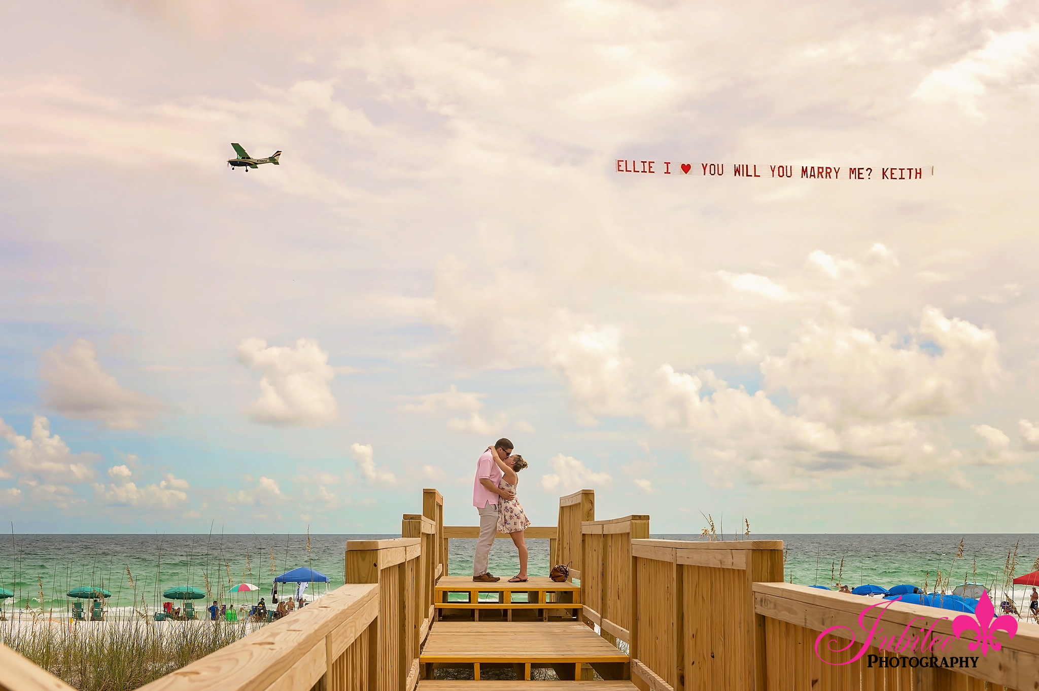Surprise Beach Proposal Photography in Seaside Florida with Airplane Banner Seaside engagement photographer captures surprise beach proposal with airplane banner