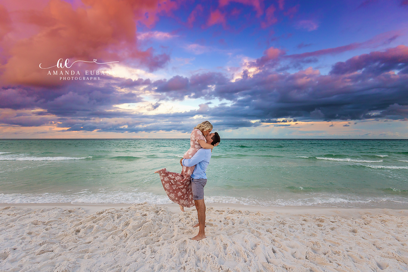 Seaside engagement photographer captures playful couple kissing on the beach