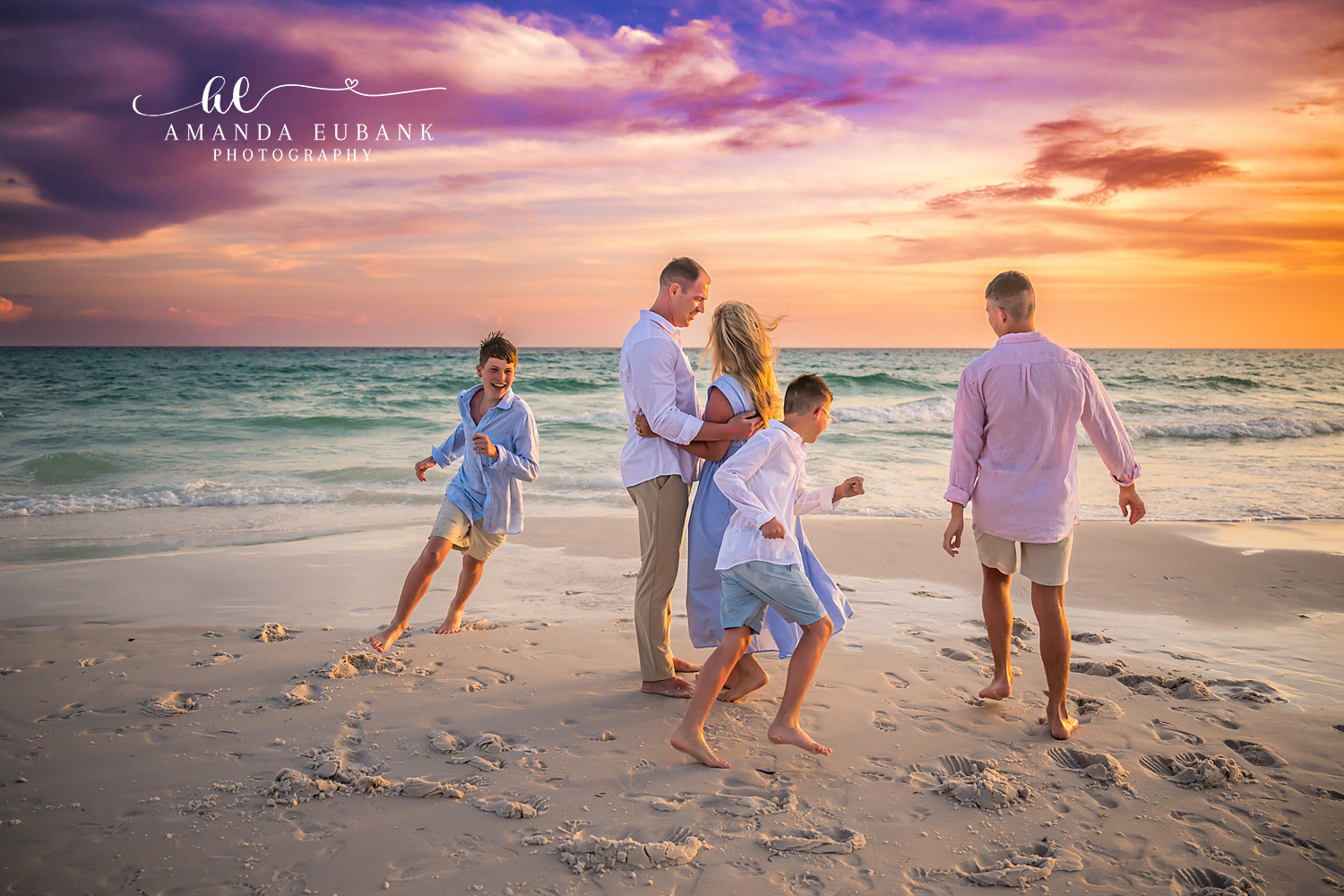 Family together on the beach at a golden sunset in Seaside Florida
