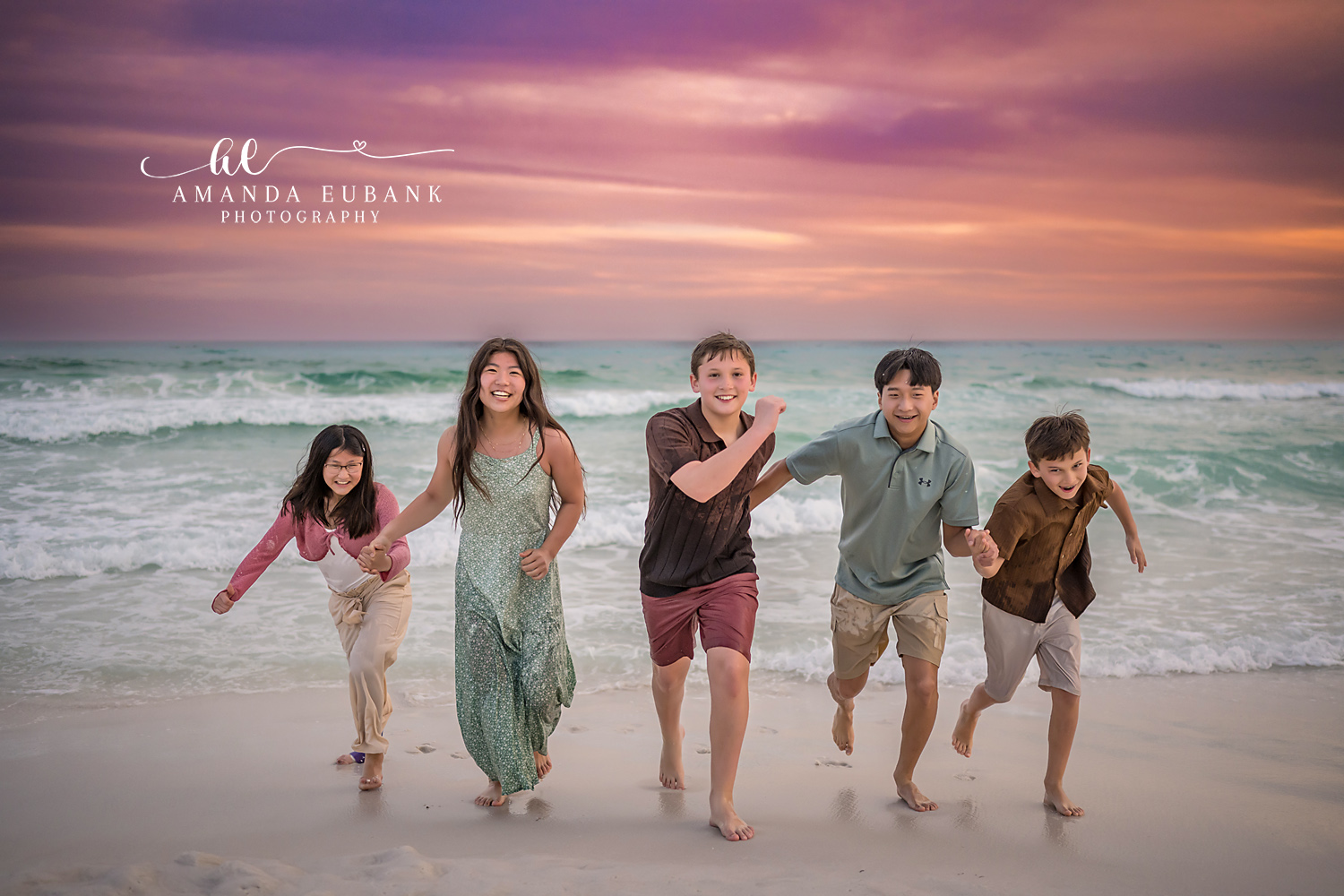 Miramar Beach photographer captures five siblings running and laughing on beach at sunset