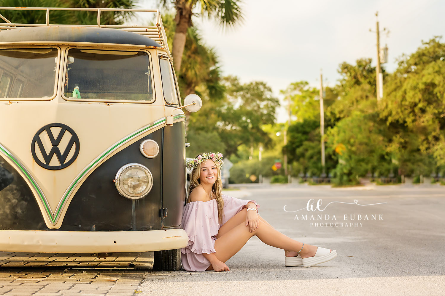 Seaside senior photographer captures boho senior with flower crown by vintage Volkswagen bus