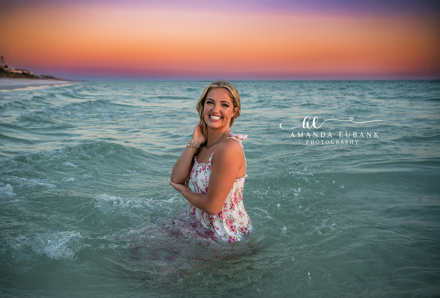 Seaside senior photographer captures smiling teen girl in the Gulf at sunset