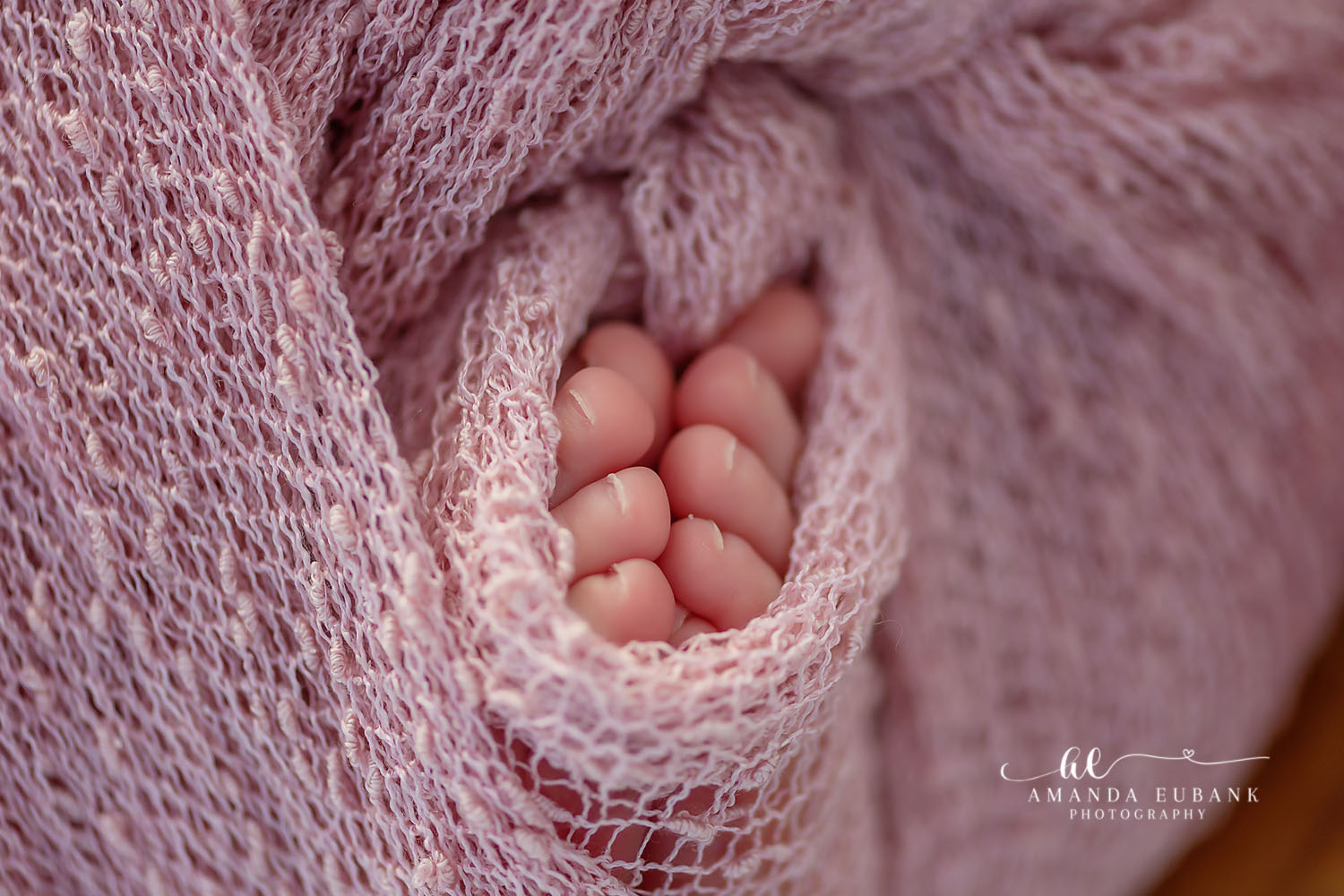 Seaside Newborn Photography | Golden Hour Beach Portrait Seaside newborn photographer documents baby girl with floral headband in a coastal-themed portrait session