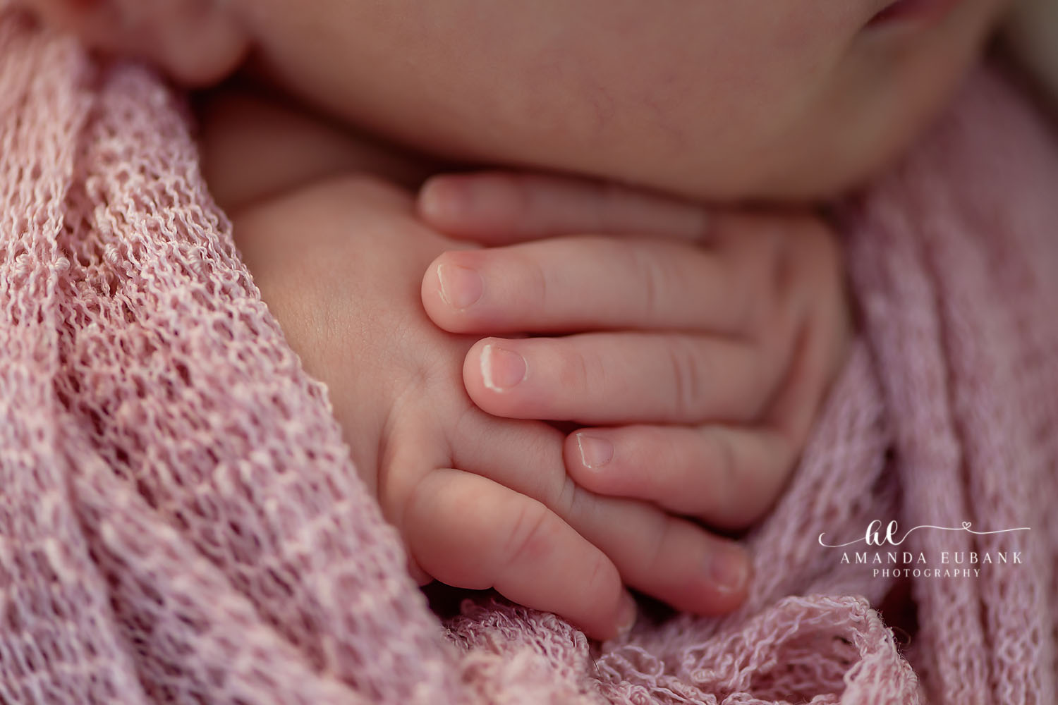 Seaside FL Newborn Photographer | Emerald Coast Newborn Session Seaside FL newborn photographer captures tiny sleeping newborn in soft pink wrap at a stunning beach sunset