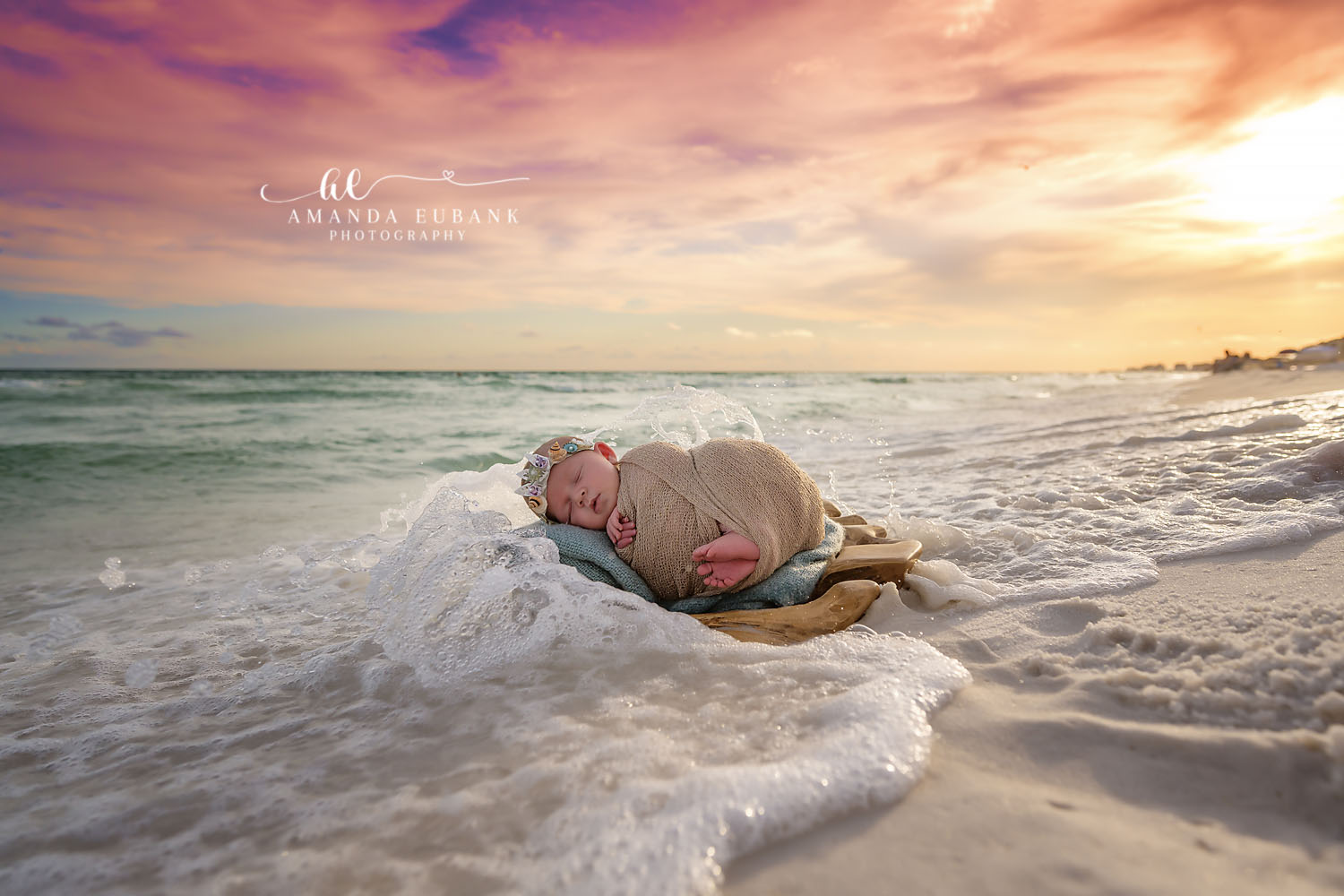Beach Newborn Photography Seaside Florida | Amanda Eubank Newborn beach portrait session by Seaside photographer Amanda Eubank with emerald water and pastel sky