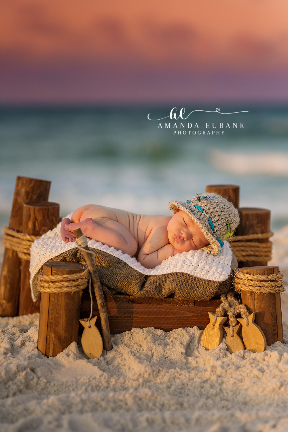 Seaside Newborn Photography | Golden Hour Beach Portrait Seaside Florida beach newborn session with sleeping baby in a driftwood bowl on the sugar-white sand