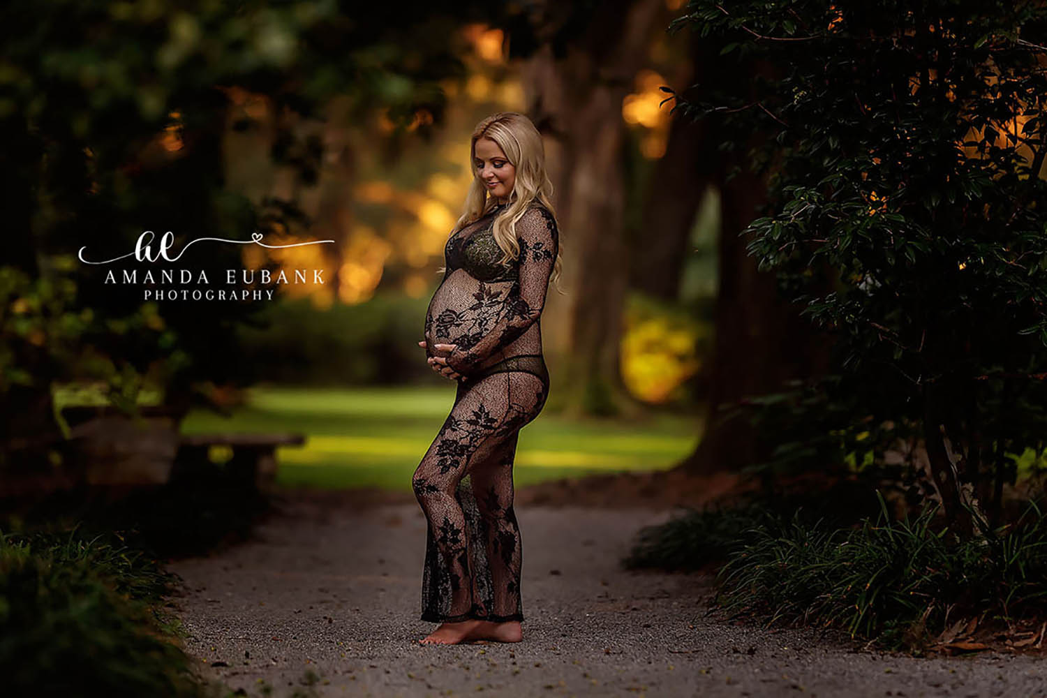 Seaside maternity photographer documents expecting mother in a lush outdoor setting with warm autumn light