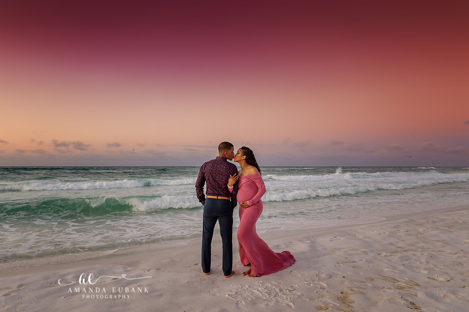 Seaside Florida beach maternity session with expecting mother posing along the Gulf of Mexico shoreline