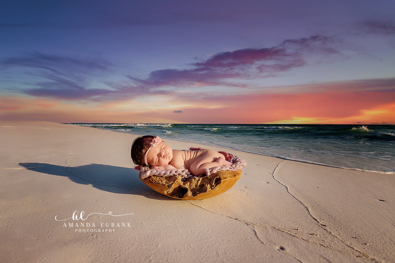 Seaside beach maternity photographer captures beautiful expecting mother in soft evening coastal light