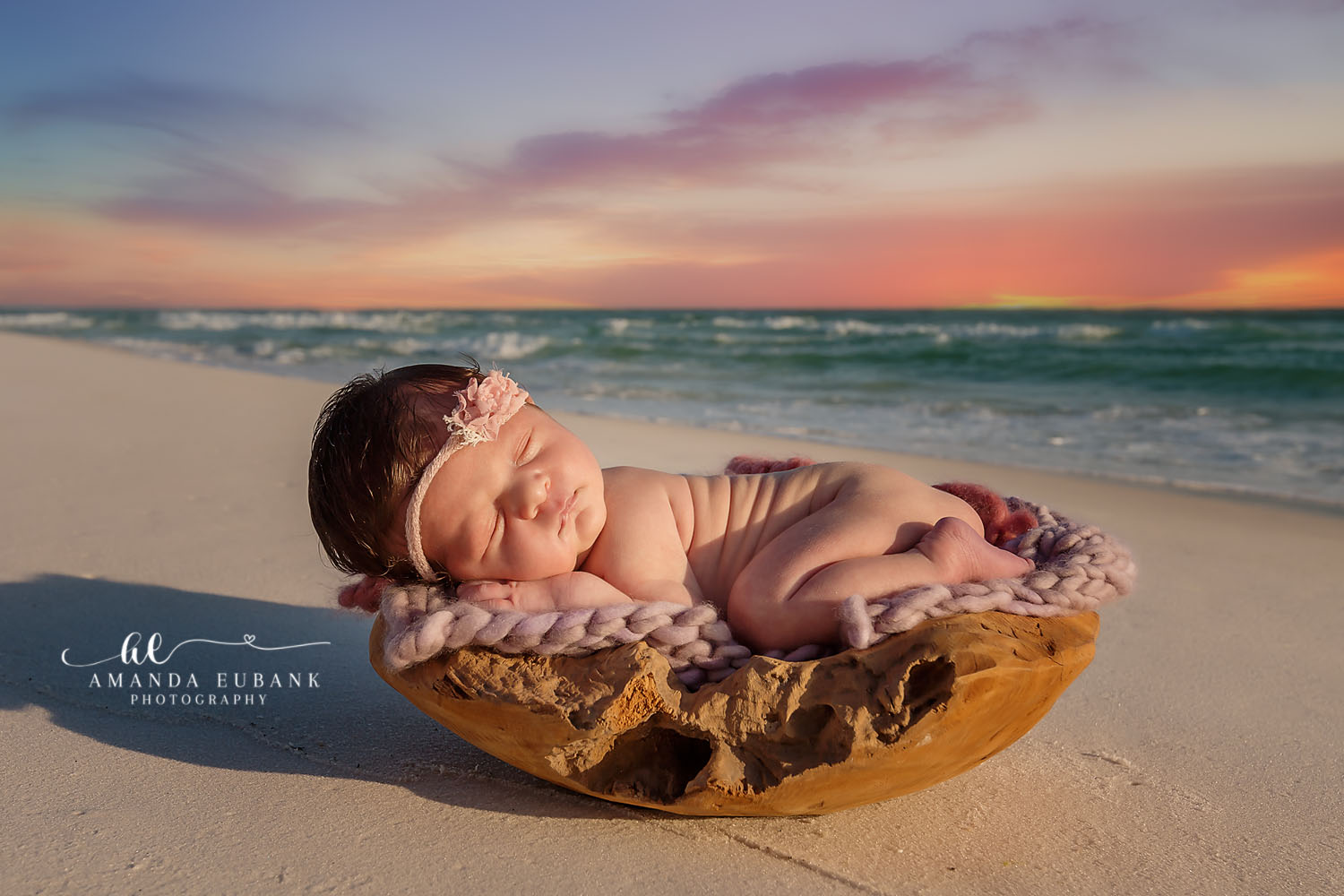 Seaside FL Maternity Photographer | Natural Light Beach Portrait Pregnant woman silhouetted against a vibrant Emerald Coast sunset during a Seaside maternity session