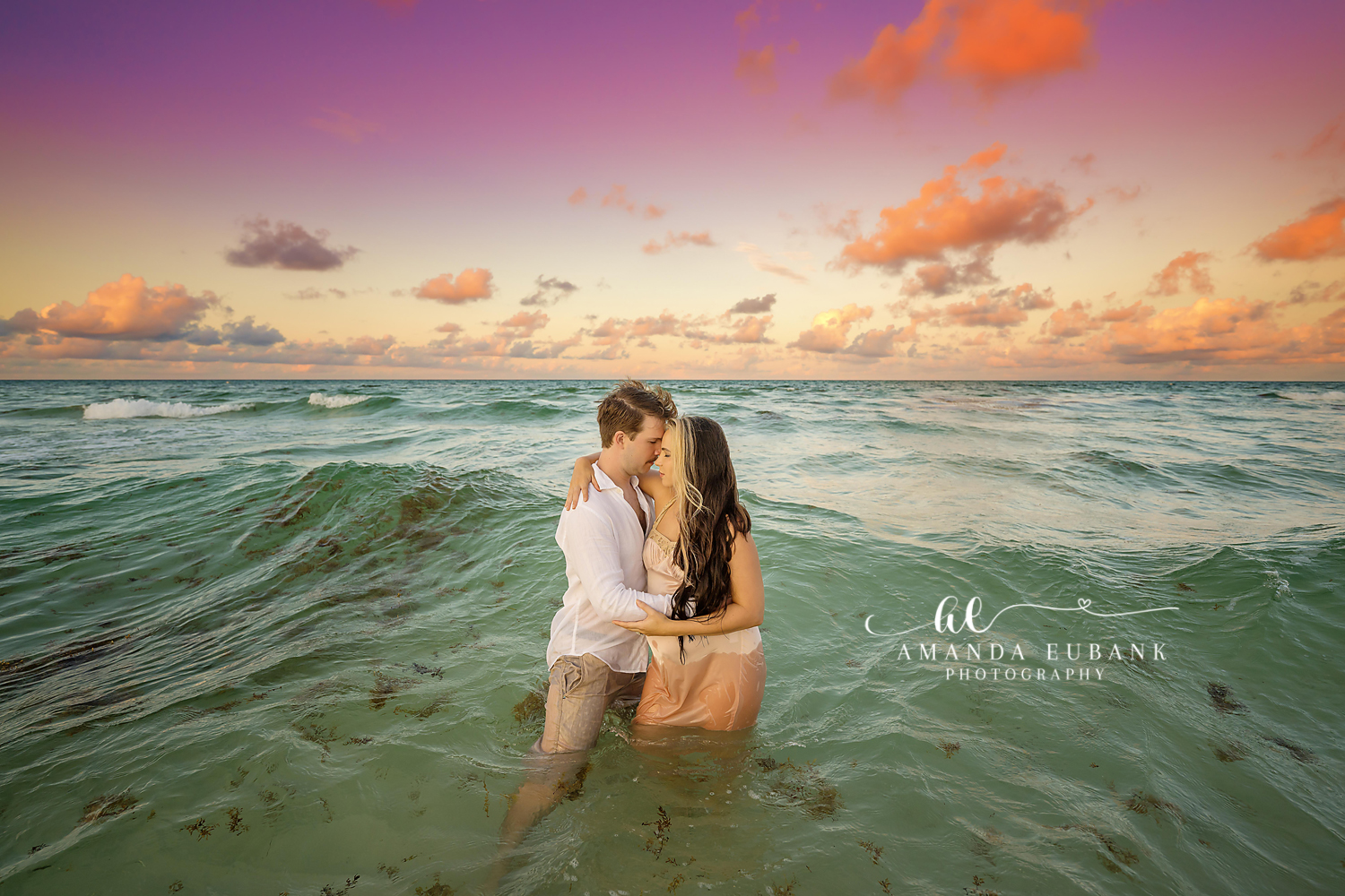 Seaside maternity photographer documents an expecting family at the water's edge at golden hour